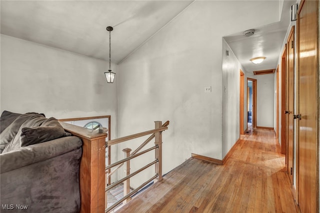 11996 Bower Rd, Minerva, OH 44657 - hall with an upstairs landing, light wood-style floors, and lofted ceiling