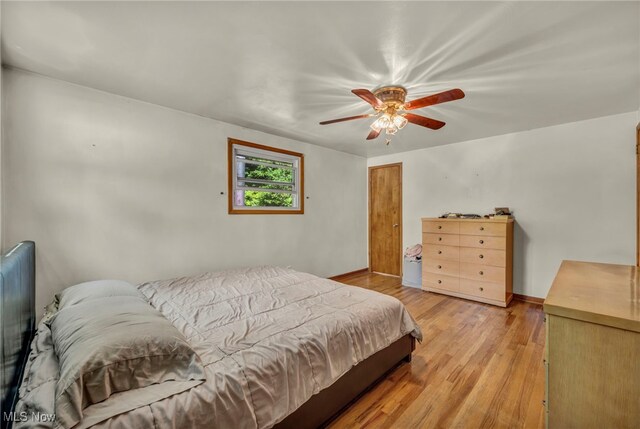 11996 Bower Rd, Minerva, OH 44657 - bedroom featuring light wood-style floors, baseboards, and ceiling fan