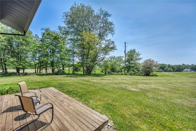 11996 Bower Rd, Minerva, OH 44657 - view of green lawn with a wooden deck