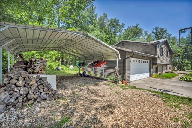 11996 Bower Rd, Minerva, OH 44657 - view of car parking with concrete driveway and an attached garage