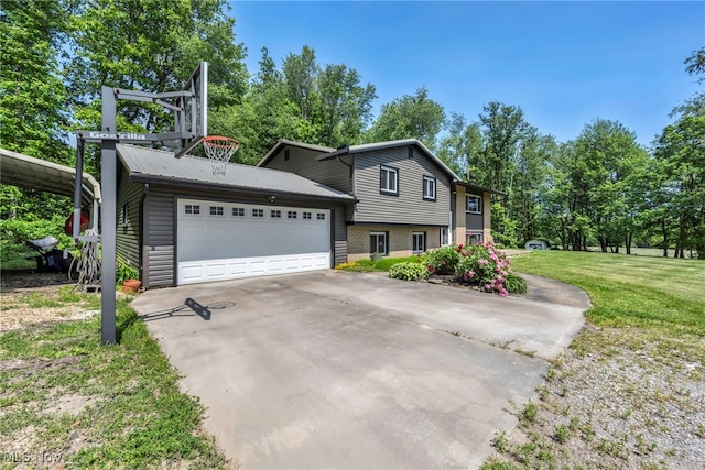 11996 Bower Rd, Minerva, OH 44657 - tri-level home featuring a front yard, an attached garage, and driveway