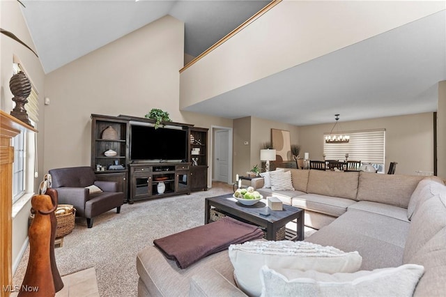 10378 N Pond Ln N Unit 2, Twinsburg, OH 44087 - carpeted living room featuring a chandelier, plenty of natural light, and high vaulted ceiling