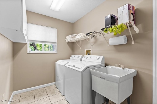 10378 N Pond Ln N Unit 2, Twinsburg, OH 44087 - laundry area with baseboards, separate washer and dryer, and light tile patterned floors