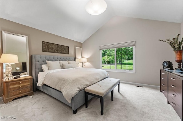 10378 N Pond Ln N Unit 2, Twinsburg, OH 44087 - bedroom with light carpet, lofted ceiling, and baseboards