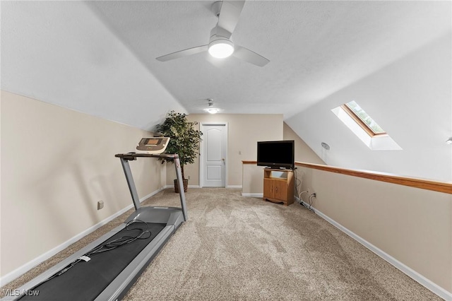 10378 N Pond Ln N Unit 2, Twinsburg, OH 44087 - exercise room with a skylight, lofted ceiling, carpet, ceiling fan, and baseboards