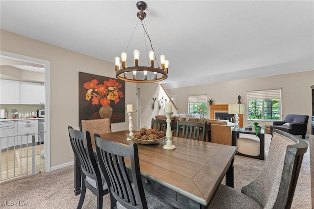 10378 N Pond Ln N Unit 2, Twinsburg, OH 44087 - dining area with light carpet and a chandelier