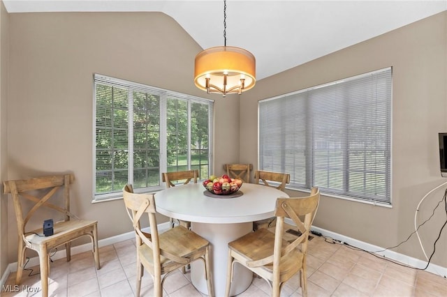 10378 N Pond Ln N Unit 2, Twinsburg, OH 44087 - dining space featuring vaulted ceiling, plenty of natural light, baseboards, and light tile patterned flooring