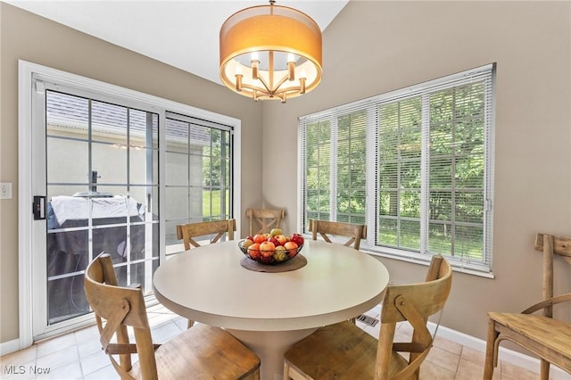 10378 N Pond Ln N Unit 2, Twinsburg, OH 44087 - dining space with light tile patterned floors, baseboards, and a chandelier