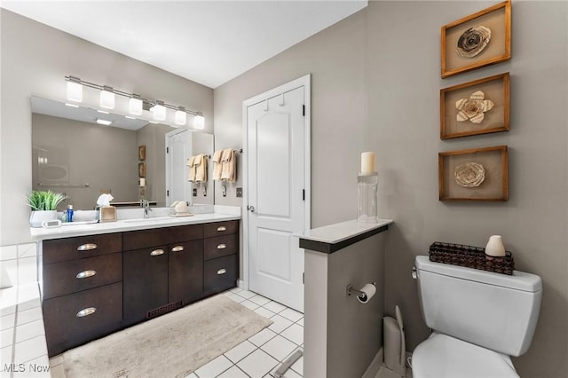 10378 N Pond Ln N Unit 2, Twinsburg, OH 44087 - bathroom with toilet, vanity, and tile patterned floors