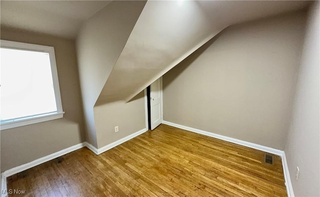 19627 Winslow Rd, Shaker Heights, OH 44122 - additional living space featuring hardwood / wood-style flooring, lofted ceiling, and baseboards
