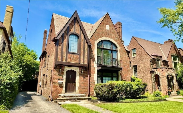 19627 Winslow Rd, Shaker Heights, OH 44122 - tudor home with brick siding and driveway