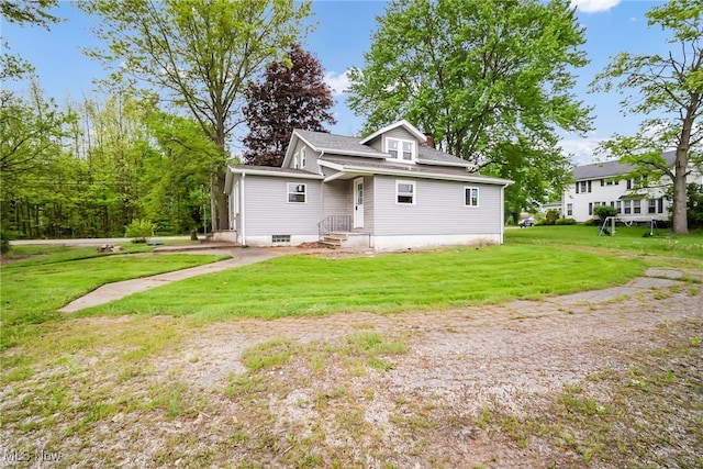4241 Greenville Rd, Cortland, OH 44410 - rear view of house featuring a lawn