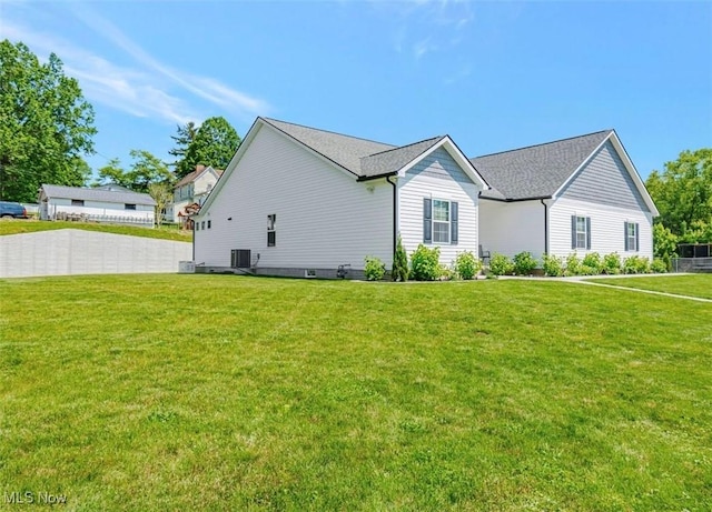 614 N 11th St, Cambridge, OH 43725 - view of side of property with a yard and central air condition unit
