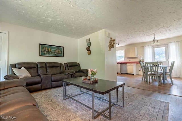 14222 Wade Ave NE, Hartville, OH 44632 - living room featuring light wood finished floors and a textured ceiling