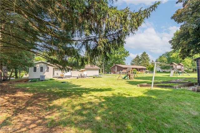 14222 Wade Ave NE, Hartville, OH 44632 - view of grassy yard with a playground