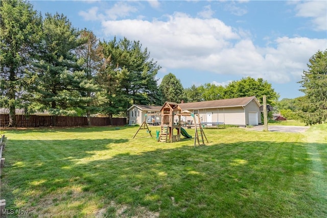 14222 Wade Ave NE, Hartville, OH 44632 - view of yard with a playground, an outbuilding, and asphalt driveway