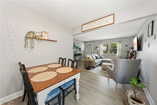3357-3359 Rocky River Dr, Cleveland, OH 44111 - dining room featuring wood finished floors and baseboards