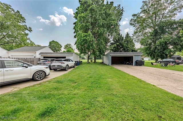 3357-3359 Rocky River Dr, Cleveland, OH 44111 - view of green lawn with an outdoor structure and a detached garage