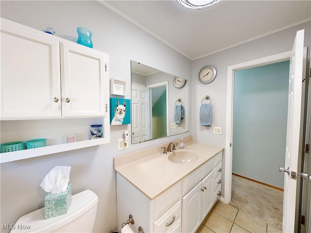 7570 Dahlia Dr, Mentor-On-The-Lake, OH 44060 - bathroom featuring toilet, vanity, tile patterned floors, and ornamental molding