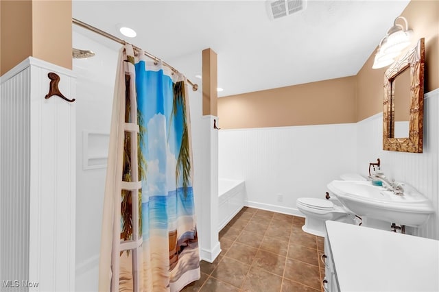 23789 Snell Rd, Columbia Station, OH 44028 - bathroom featuring wainscoting, tile patterned floors, toilet, a sink, and a shower with curtain