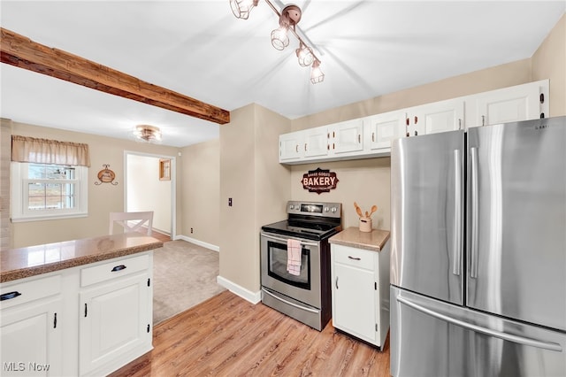 23789 Snell Rd, Columbia Station, OH 44028 - kitchen with stainless steel appliances, white cabinets, light wood-style floors, beamed ceiling, and light countertops