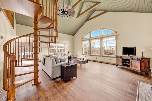 23789 Snell Rd, Columbia Station, OH 44028 - living room featuring high vaulted ceiling, stairs, wood finished floors, and baseboards