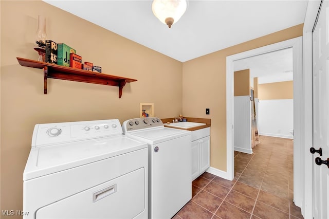 23789 Snell Rd, Columbia Station, OH 44028 - laundry area featuring separate washer and dryer, cabinet space, baseboards, and tile patterned flooring