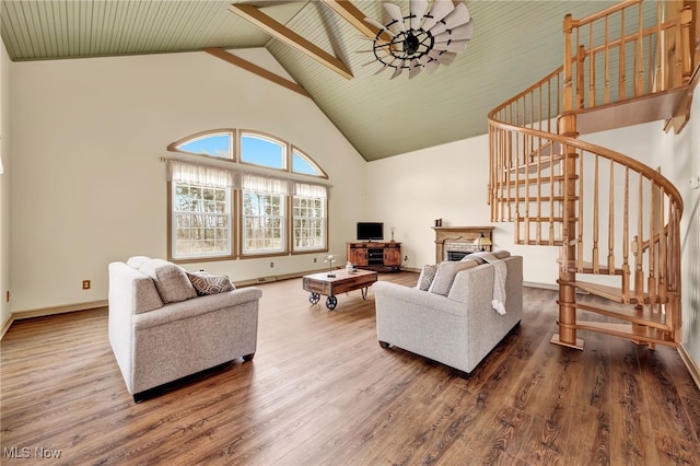 23789 Snell Rd, Columbia Station, OH 44028 - living area with high vaulted ceiling, stairway, wood finished floors, baseboards, and a fireplace