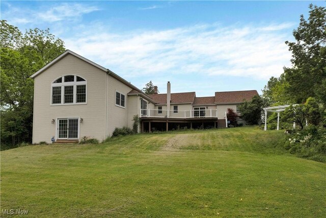 23789 Snell Rd, Columbia Station, OH 44028 - back of property with a lawn, a deck, and a chimney
