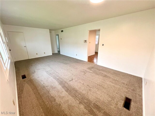818 2nd St, Brilliant, OH 43913 - spare room featuring carpet floors and baseboards