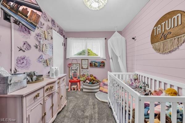 23 Sprague Rd, Berea, OH 44017 - carpeted bedroom featuring a crib and wood walls