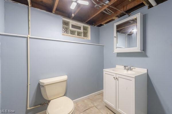23 Sprague Rd, Berea, OH 44017 - bathroom featuring vanity, toilet, tile patterned flooring, and baseboards