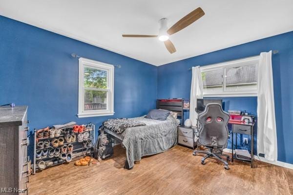 23 Sprague Rd, Berea, OH 44017 - bedroom featuring wood finished floors, ceiling fan, and baseboards