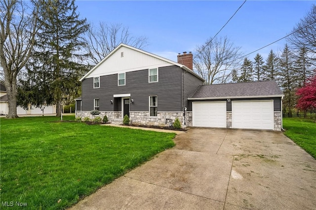 5433 Fleetwood Ave NW, Canton, OH 44718 - back of house featuring stone siding, concrete driveway, a chimney, and a yard