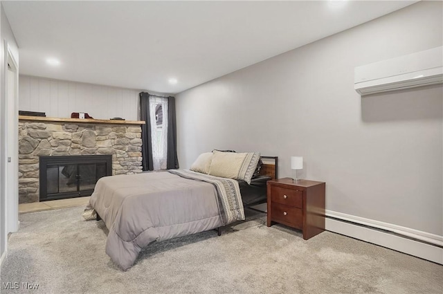 5433 Fleetwood Ave NW, Canton, OH 44718 - bedroom featuring carpet floors, a baseboard heating unit, a wall unit AC, a stone fireplace, and recessed lighting