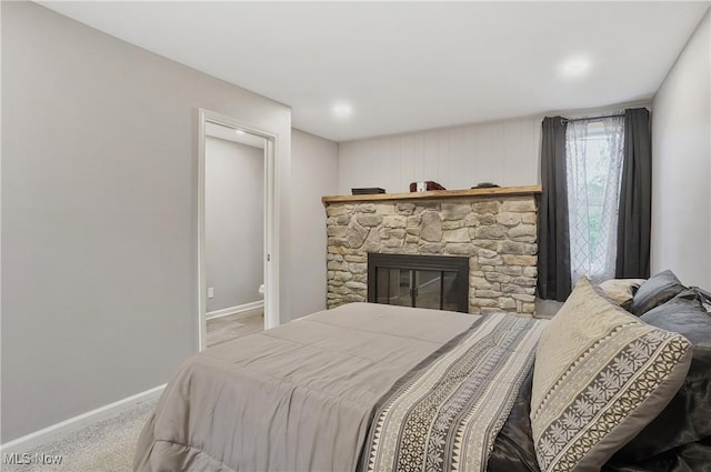 5433 Fleetwood Ave NW, Canton, OH 44718 - bedroom with baseboards, carpet, and a fireplace