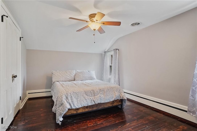 5433 Fleetwood Ave NW, Canton, OH 44718 - bedroom featuring baseboard heating, wood-type flooring, lofted ceiling, and baseboards