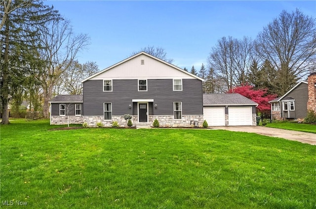5433 Fleetwood Ave NW, Canton, OH 44718 - rear view of property featuring driveway, a yard, stone siding, and a garage