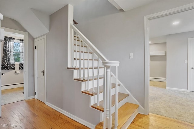 5433 Fleetwood Ave NW, Canton, OH 44718 - stairs with baseboard heating, hardwood / wood-style floors, and baseboards