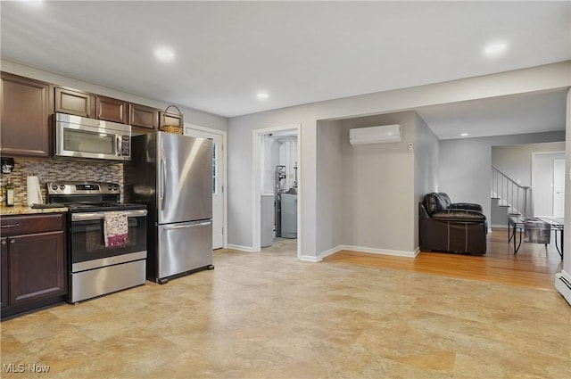 5433 Fleetwood Ave NW, Canton, OH 44718 - kitchen with appliances with stainless steel finishes, dark brown cabinetry, an AC wall unit, backsplash, and baseboards