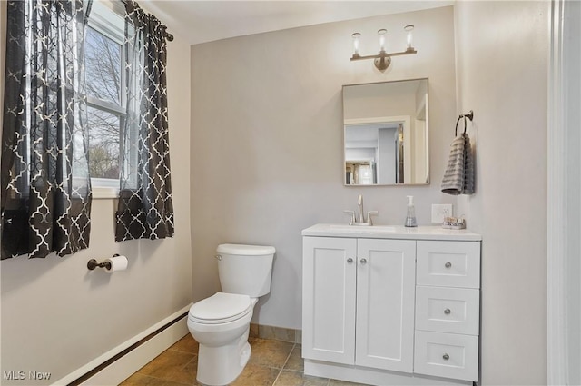 5433 Fleetwood Ave NW, Canton, OH 44718 - bathroom featuring baseboards, vanity, toilet, and healthy amount of natural light