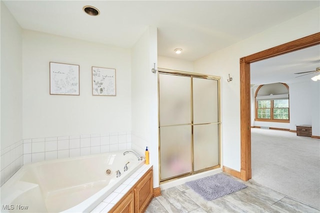 5968 Winchell Rd, Hiram, OH 44234 - bathroom featuring a tub with jets, a shower stall, ceiling fan, and baseboards
