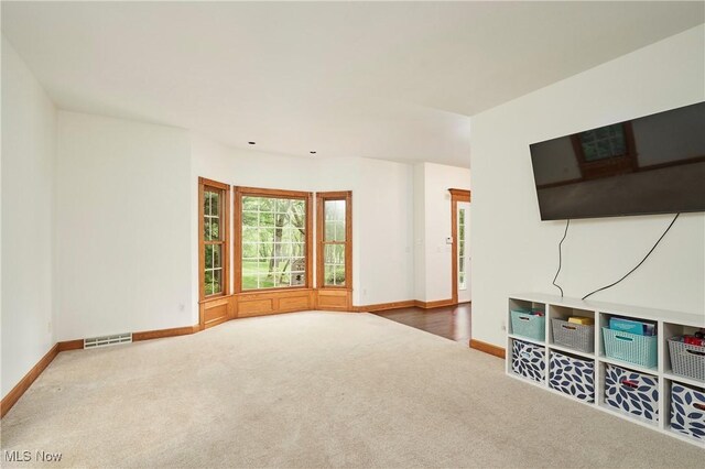 5968 Winchell Rd, Hiram, OH 44234 - unfurnished living room with baseboards and carpet floors