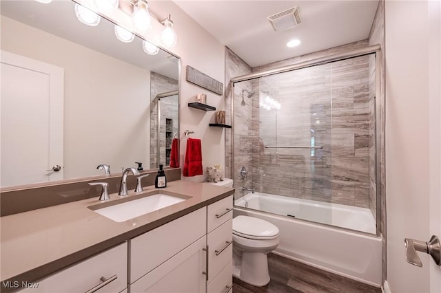 6268 Summers Rd, Windsor, OH 44099 - bathroom with wood finished floors, toilet, vanity, and enclosed tub / shower combo