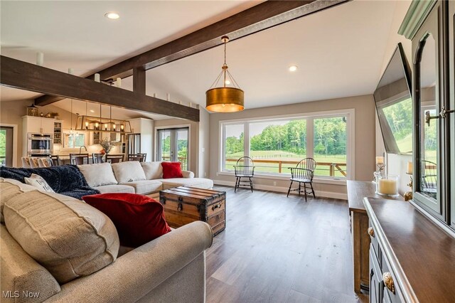 6268 Summers Rd, Windsor, OH 44099 - living area featuring wood finished floors, healthy amount of natural light, recessed lighting, and a chandelier