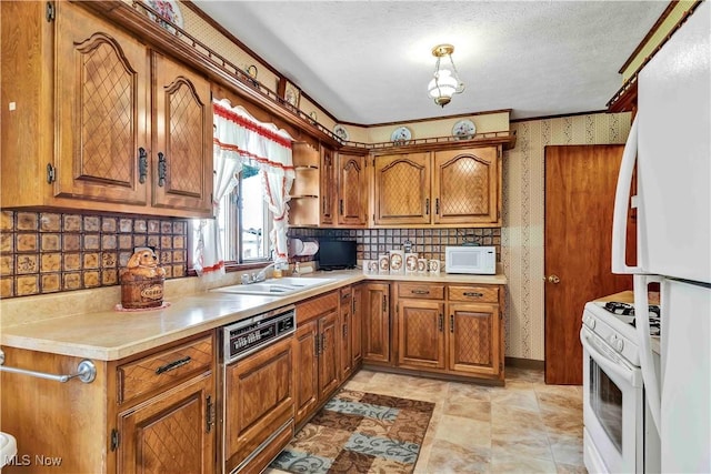 3622 Valacamp Ave SE, Warren, OH 44484 - kitchen with white appliances, brown cabinets, and light countertops