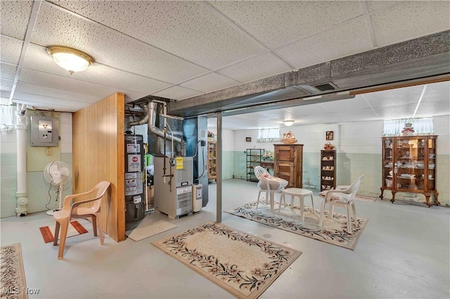 3622 Valacamp Ave SE, Warren, OH 44484 - basement featuring heating unit, a drop ceiling, electric panel, and water heater