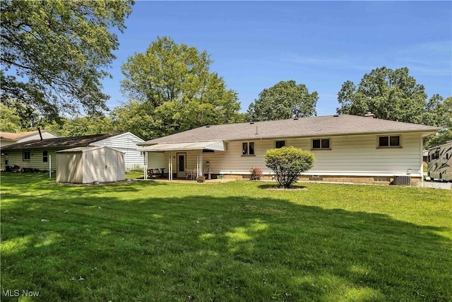 3622 Valacamp Ave SE, Warren, OH 44484 - back of property with a lawn, central AC unit, and a patio
