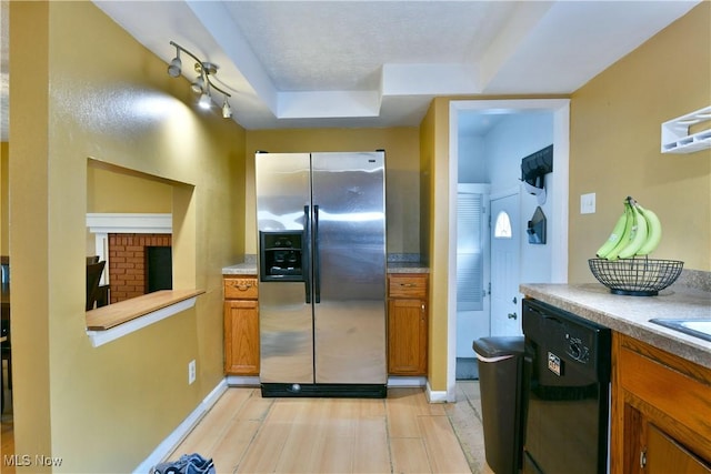 895 Elmwood Dr, Hubbard, OH 44425 - kitchen featuring stainless steel refrigerator with ice dispenser, dishwasher, brown cabinetry, and a tray ceiling