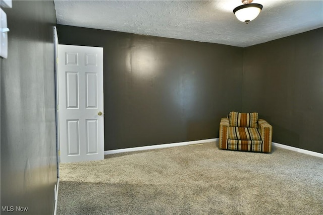 895 Elmwood Dr, Hubbard, OH 44425 - unfurnished room featuring carpet floors, a textured ceiling, and baseboards